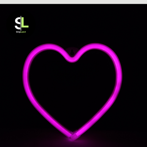 Cuore LED neon acceso con luce rosa intensa, insegna decorativa romantica per interni.