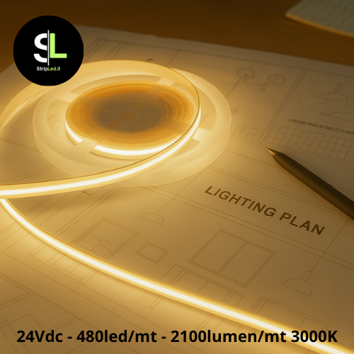 Striscia LED COB 24V bianco caldo 3000K accesa su piano tecnico con luce continua e uniforme.