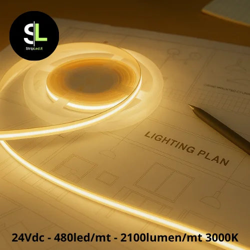 Striscia LED COB 24V bianco caldo 3000K accesa su piano tecnico con logo StripLed.it